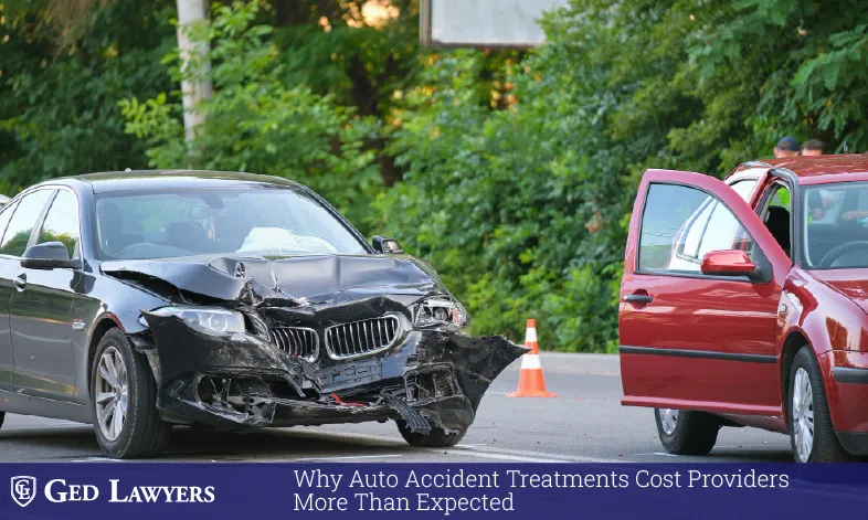Damaged black sedan and red car after a road collision, illustrating auto accident treatment cost concerns
